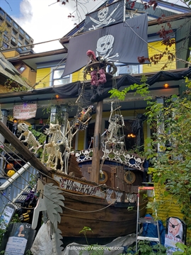 Elaborate pirate ship decoration built across a front lawn on Bute Street