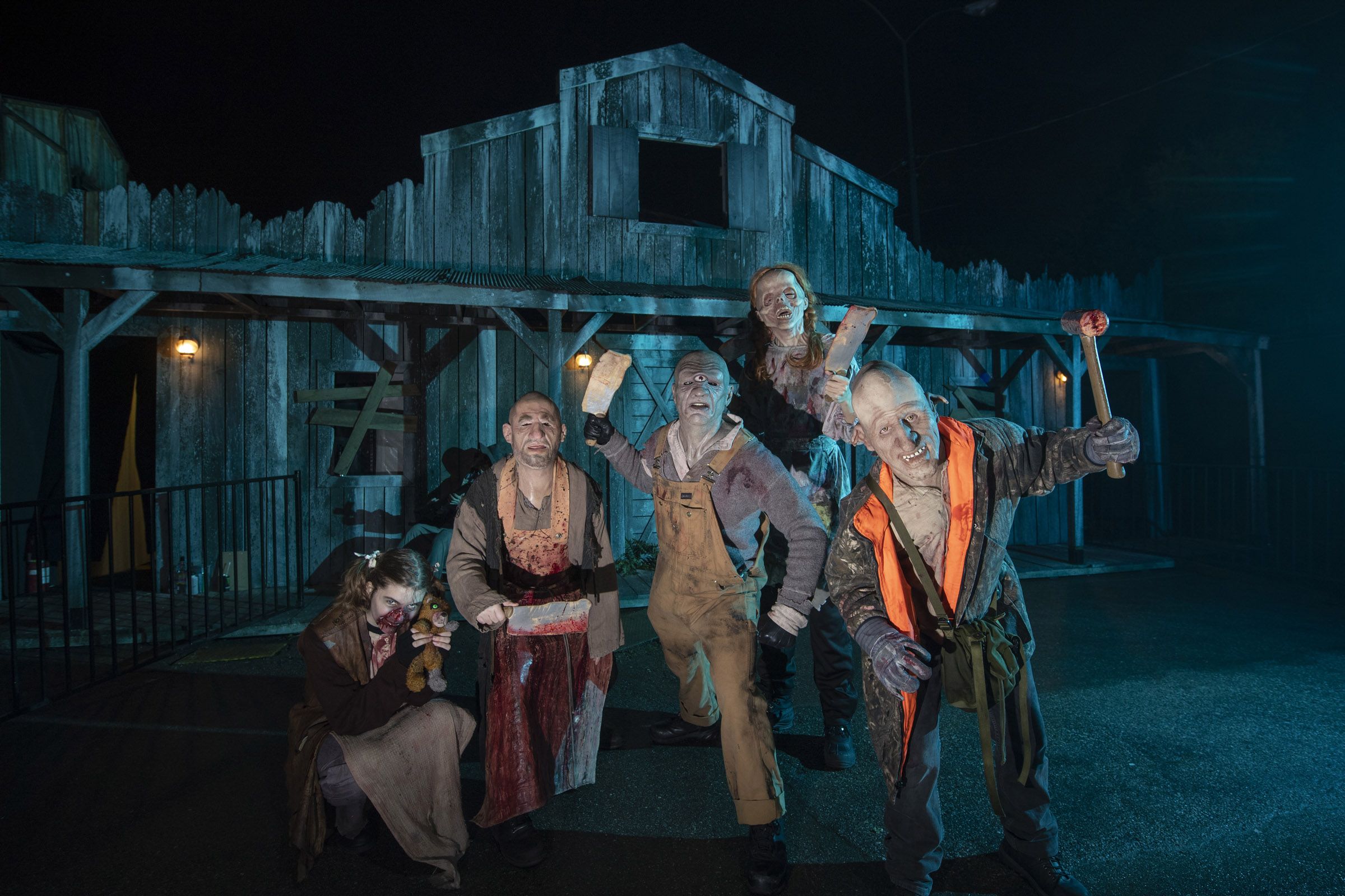 Fright Nights amusement rides illuminated under atmospheric dark park conditions