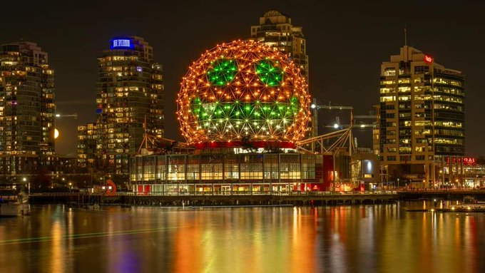 ScienceWorld in Vancouver lit up with orange spooky lights for Halloween night celebrations