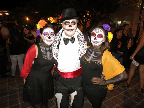 Traditional decorative skeleton figures dressing as Catrinas for Day of the Dead Dia de los Muertos events